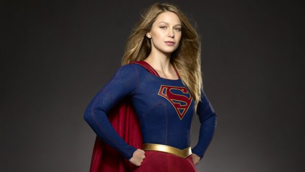 Melissa Benoist stands confidently in her Supergirl costume with a red cape, 4K Desktop Wallpaper