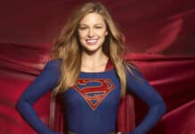 Melissa Benoist as Supergirl standing with hands on hips wearing the iconic costume, 2K Desktop Wallpaper