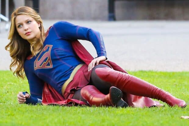 Melissa Benoist is lying on grass in her Supergirl costume, HD Desktop Wallpaper