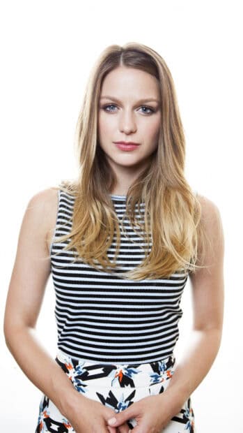A portrait of Melissa Benoist wearing a black and white striped top and patterned skirt, 4K Phone Wallpaper