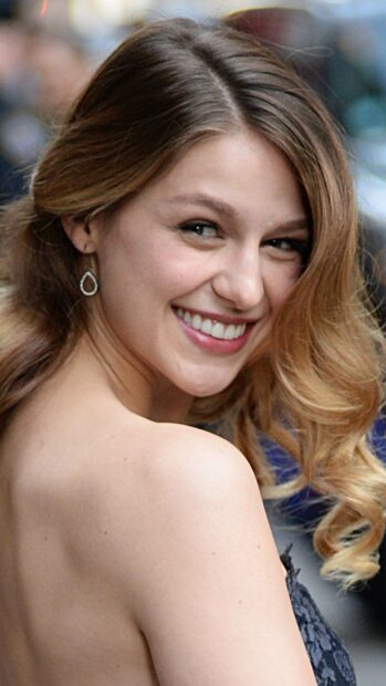 Melissa Benoist wallpapers shows a woman with curled hair smiling at the camera, HD Mobile Wallpaper