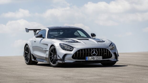 A silver Mercedes Benz AMG GT car parked under a cloudy sky, 2K Desktop Wallpaper