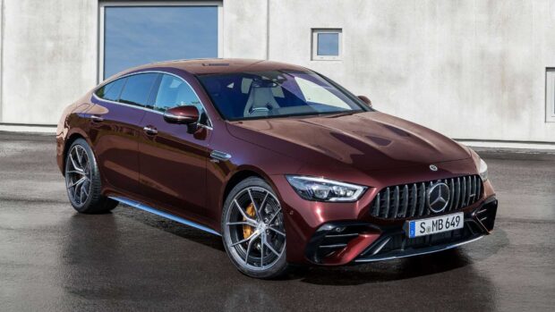 A maroon Mercedes Benz Amg Gt parked in front of a concrete wall, HD Desktop Wallpaper