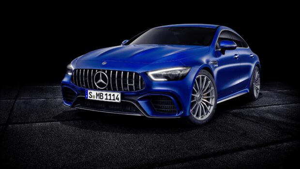 A blue Mercedes Benz Amg Gt car is displayed on a dark textured surface, 4K Desktop Wallpaper