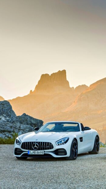 A white Mercedes Benz Amg Gt parked on gravel with rocky mountains in the background, HD Phone Wallpaper