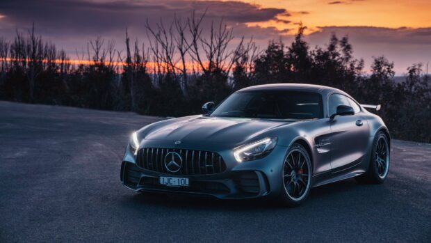 A Mercedes Benz Amg Gt is parked on a road at sunset with trees in the background, HD Desktop Wallpaper