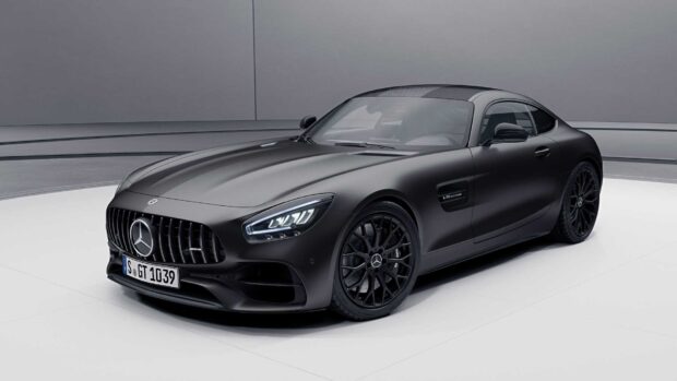 A sleek black Mercedes Benz Amg Gt is displayed in a modern showroom setting, HD Desktop Wallpaper