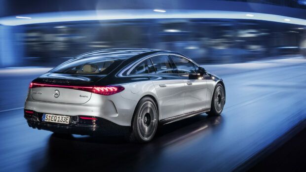 A silver Mercedes Benz EQS is driving fast through a modern tunnel at night, 2K Desktop Wallpaper