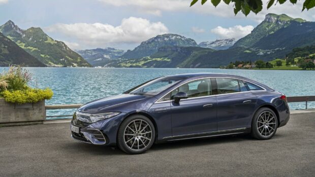 A Mercedes Benz Eqs parked by a lake with mountains in the background, 2K Desktop Wallpaper