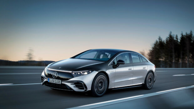 A Mercedes Benz Eqs electric sedan is driving on a scenic highway at dusk, Mercedes Benz Eqs Wallpapers, 2K Desktop Wallpaper
