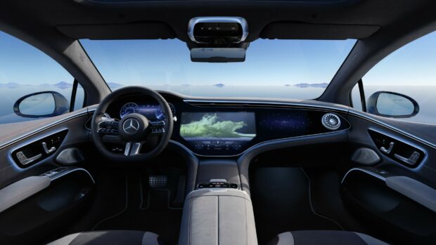 The interior of the Mercedes Benz Eqs shows a sleek dashboard with digital displays, 2K Desktop Wallpaper