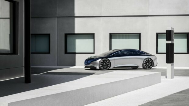 A silver Mercedes Benz Eqs is parked near a modern building with shadows, HD Desktop Wallpaper
