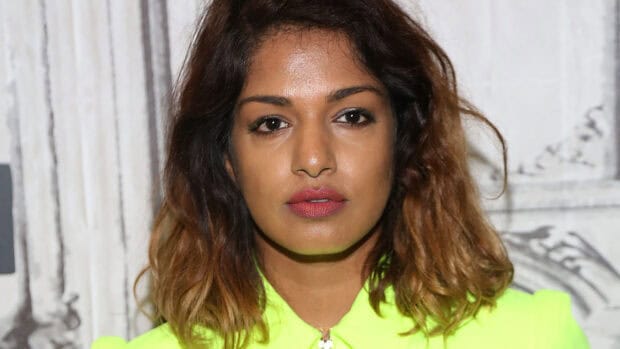 Mia rapper looks straight into the camera wearing a neon green top, HD Desktop Wallpaper