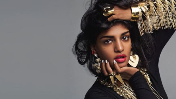 Mia rapper with striking jewelry and makeup posing against gray, HD Desktop Wallpaper