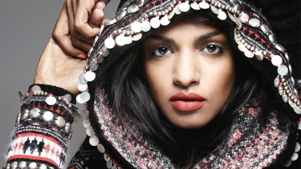 A close up portrait showing Mia rapper with intricate clothing details, HD Desktop Wallpaper