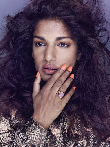 A close up portrait of Mia rapper with hand near her face showing vibrant nails, HD Mobile Wallpaper