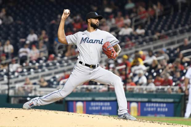 A Miami Marlins player is winding up to pitch during a game on the field, 2K Desktop Wallpaper
