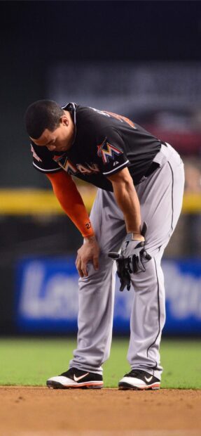 A Miami Marlins player is leaning forward during a game, 2K Mobile Wallpaper