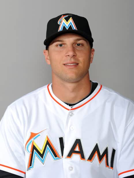 A Miami Marlins player wearing the team uniform and cap poses for a portrait, 2K Phone Wallpaper