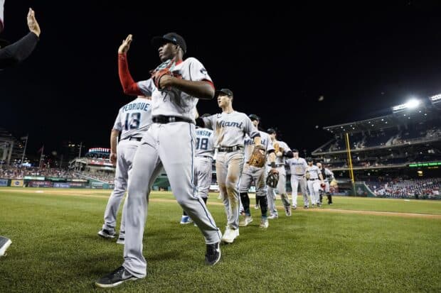The Miami Marlins players are celebrating on the baseball field after the game, 2K Desktop Wallpaper