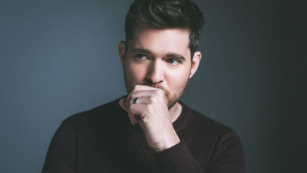 Michael Buble is wearing a dark sweater and looking thoughtfully to the side, 4K Desktop Wallpaper