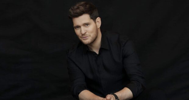A portrait of Michael Buble wearing a black shirt against a dark background, HD Desktop Wallpaper
