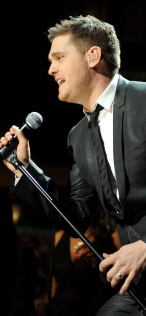 Michael Buble sings passionately into the microphone during a live show, HD Mobile Wallpaper
