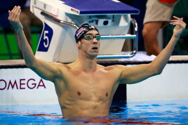 Michael Phelps celebrating with arms raised after a swim race, HD Desktop Wallpaper