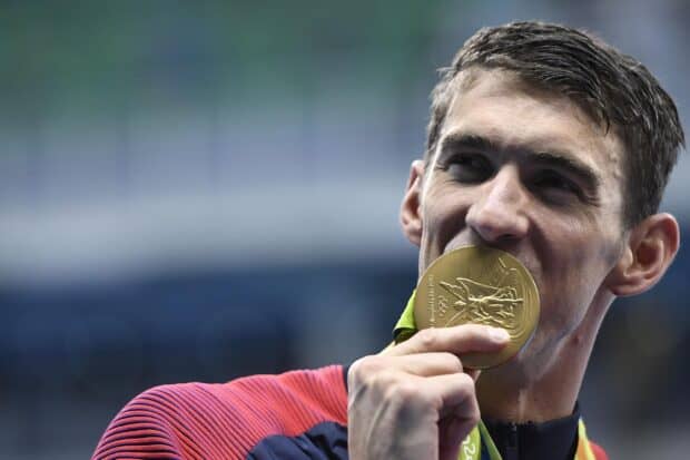 Michael Phelps celebrates winning a gold medal at the Olympic Games, HD Desktop Wallpaper