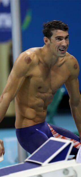 Michael Phelps celebrating a swim at a competitive event, 2K Mobile Wallpaper