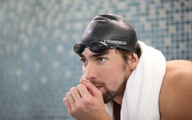 Michael Phelps is deeply focused and preparing mentally before swimming, 2K Desktop Wallpaper