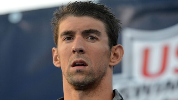 Michael Phelps is focused and deep in thought during a sports event, 2K Desktop Wallpaper