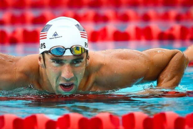 Michael Phelps swimming intensely in the pool during a competition, 2K Desktop Wallpaper