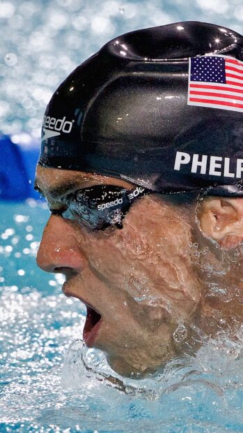 Michael Phelps is focused during a swim race wearing a cap and goggles, HD Mobile Wallpaper