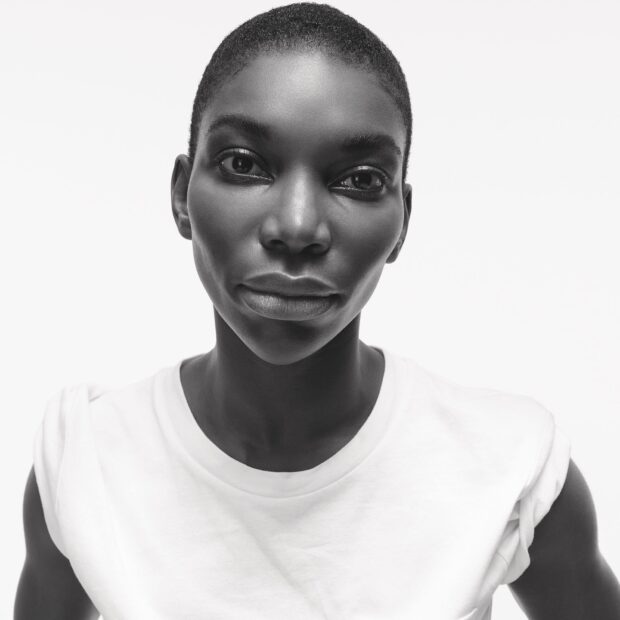 Michaela Coel is looking directly into the camera with a neutral expression, HD Mobile Wallpaper