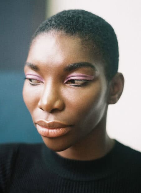 Michaela Coel shows soft pink eye makeup in a close up portrait, HD Phone Wallpaper