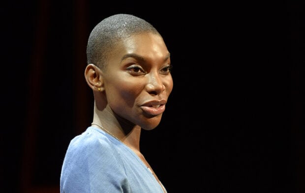 Michaela Coel is captured in a close up portrait with a dark background, HD Desktop Wallpaper