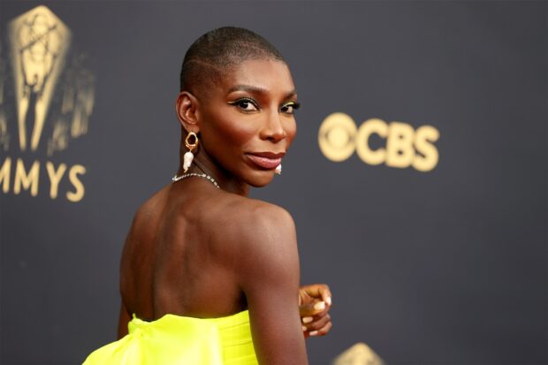 Michaela Coel wears a bright yellow dress looking over her shoulder at the CBS Emmy Awards, HD Desktop Wallpaper