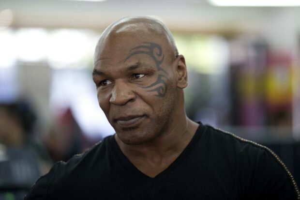 Mike Tyson shows a calm expression with his face tattoo visible, 2K Desktop Wallpaper