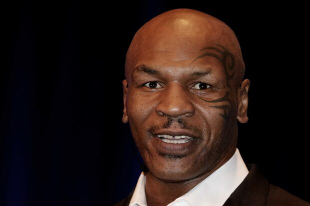 A close up portrait of Mike Tyson with his face tattoo clearly visible, 2K Desktop Wallpaper