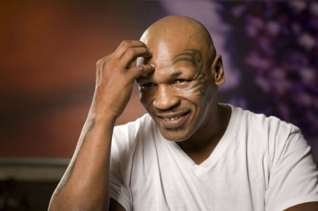 Mike Tyson Wallpapers showing a close up of a smiling Mike Tyson with a facial tattoo, HD Desktop Wallpaper