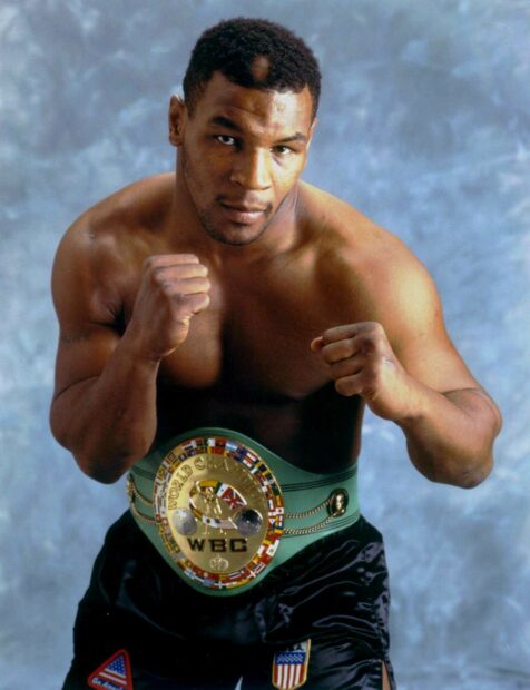 Mike Tyson with his fists raised wearing the WBC championship belt, HD Desktop Wallpaper