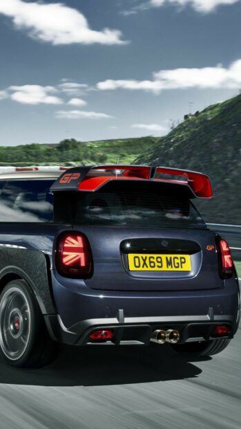 A Mini Cooper GP is driving on a curvy road with a scenic background, HD Mobile Wallpaper