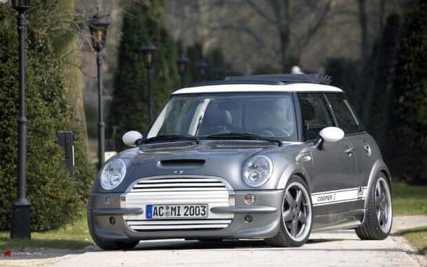 A silver Mini Cooper is parked on a path near trees and lamp posts, HD Desktop Wallpaper