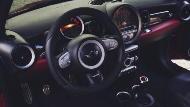 A close up view of the Mini Cooper steering wheel and dashboard inside the car, 4K Desktop Wallpaper