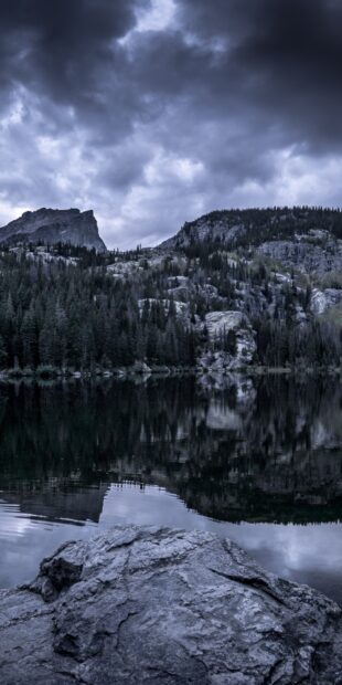 The misty landscape of Rocky Mountain National Park reflects on the calm lake surface, HD Phone Wallpaper