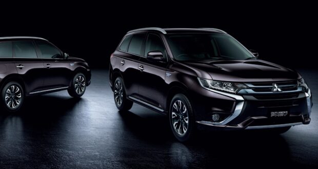 A sleek Mitsubishi Outlander PHEV is shown with detailed design and glossy black paint, 4K Desktop Wallpaper