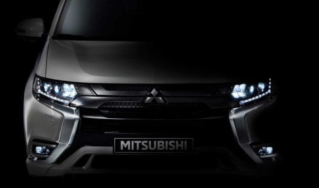 The Mitsubishi Outlander shows bright LED headlights in a dark setting, HD Desktop Wallpaper