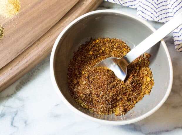 A close up of mixed seasoning spices in a gray bowl with a spoon inside, HD Desktop Wallpaper