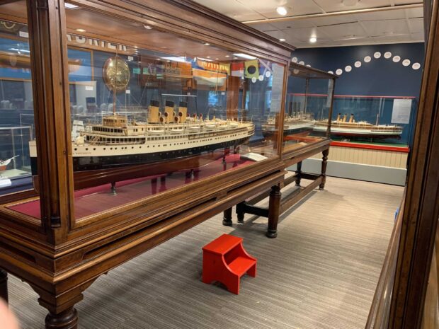 Model ships displayed in glass cases at the Maritime Museum exhibit, 2K Desktop Wallpaper